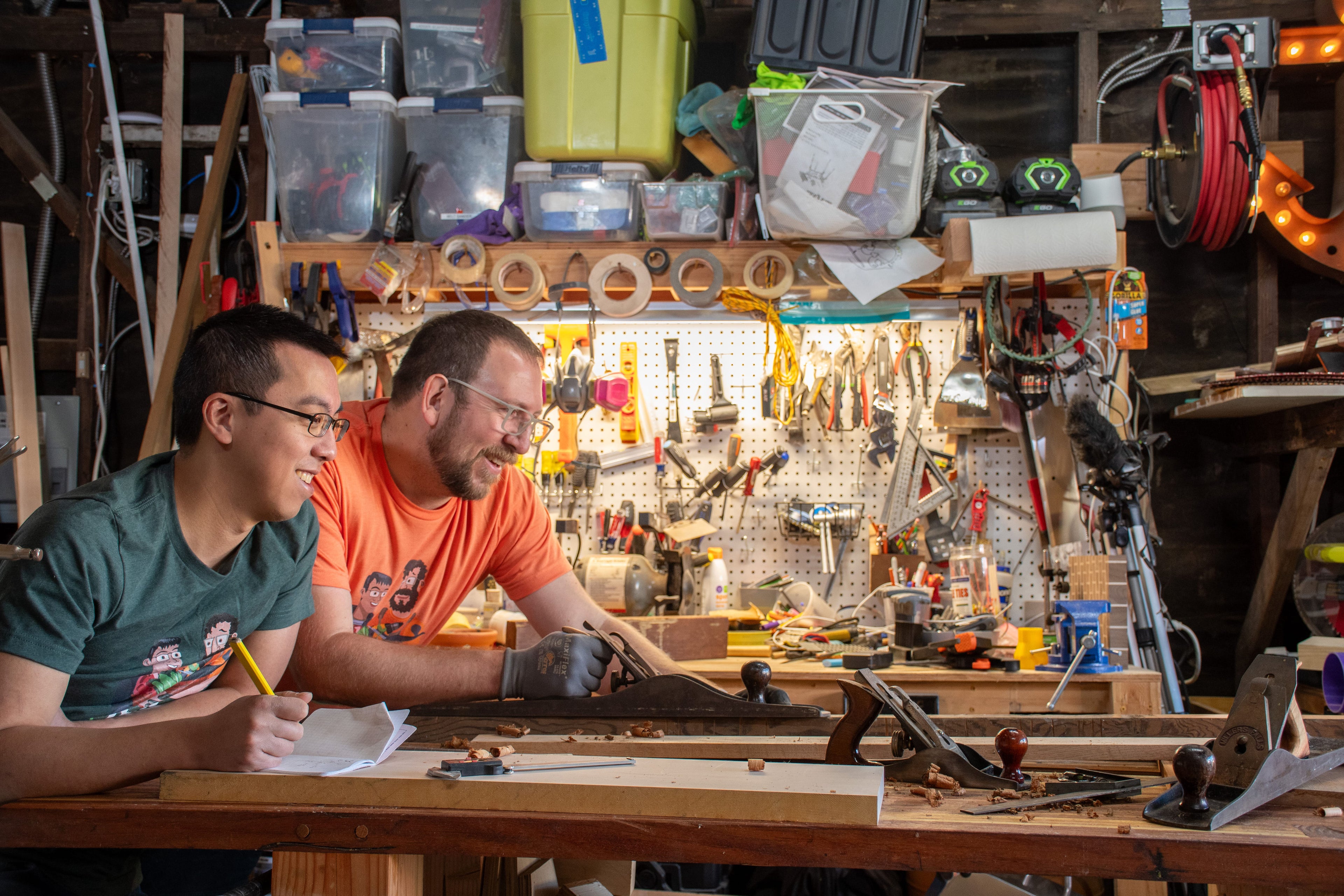 Dan and Andy woodworking together in the workshop.